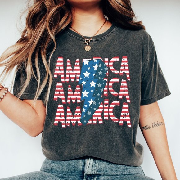 Trendy Patriotic America Stars Stripes Lightning Bolt USA July 4th Graphic Tee - Picture 1 of 5